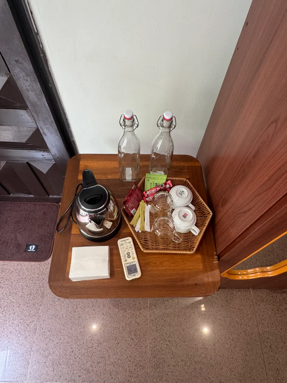 Tea tray with kettle and glass water bottles